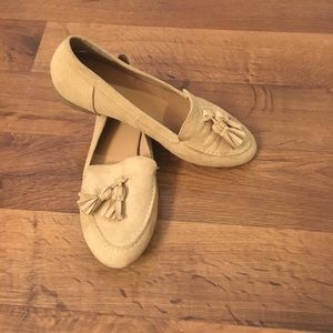 Faux suede nude tassel flats